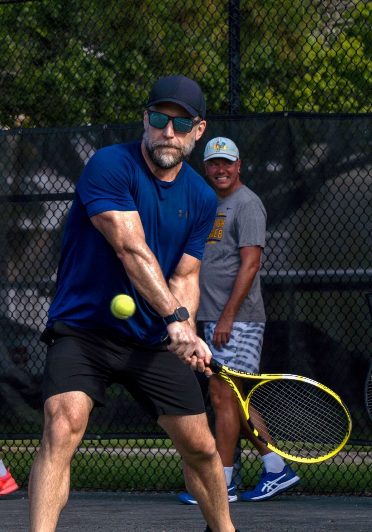 Men's tennis clinic on the courts at The Racquet Club of St. Petersburg